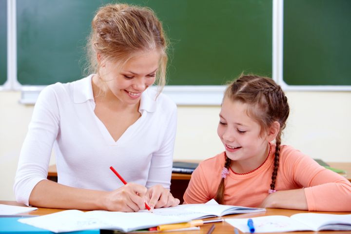 Mom checking daughter's Spelling Power test